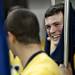 Michigan junior cheerleader Chris Fraga smiles while holding a flag before the game against Western Michigan on Tuesday. Daniel Brenner I AnnArbor.com